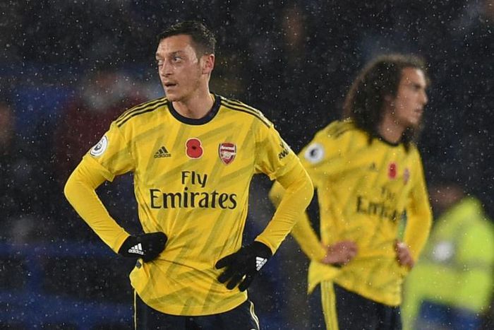 Midfielders Mesut Ozil (left) and Matteo Guendouzi are currently on the sidelines at Arsenal