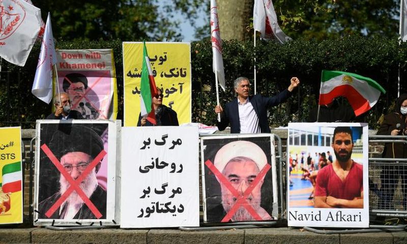 Protesters demonstrate outside the Iranian embassy in London on September 12, 2020 against the execution of Iranian wrestler Navid Afkari in the southern Iranian city of Shiraz and against the Iranian government