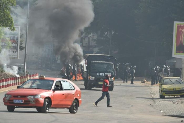 Five people have been killed and over 100 injured in three days of street clashes following President Alassane Ouattara's decision to seek a third term, the government said, urging calm.
