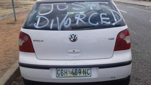 Man celebrates divorce by driving all over town in a car littered with "Just Divorced"