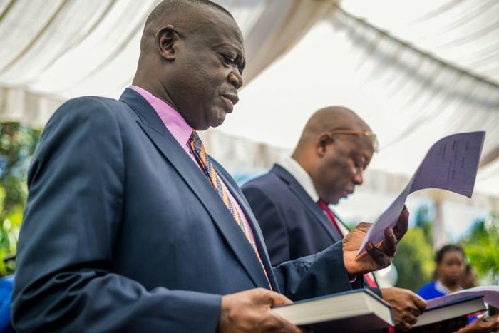Shiri, left, taking his oath of office as agriculture minister in December 2017