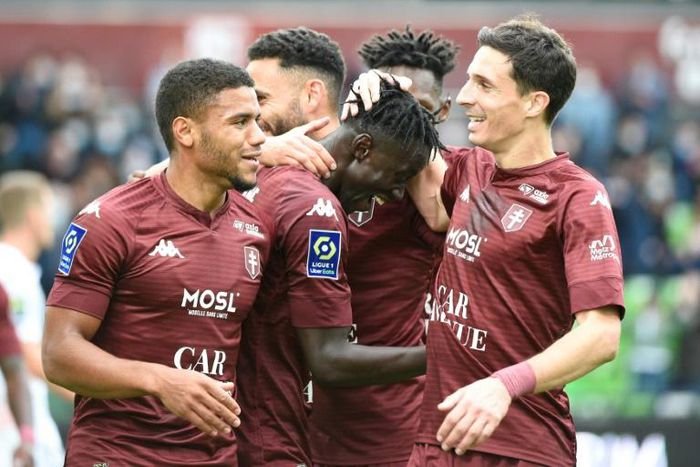 Senegalese Ibrahima Niane (C) celebrates one of his goals for Metz in a Ligue 1 hat-trick against Lorient.