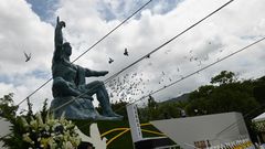 Doves fly during a ceremony marking the 75th anniversary of the atomic bombing of Nagasaki, at the city's Peace Park