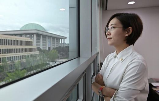 Jang Hye-yeong looks out of her office window towards South Korea's legislature, which she called 'an institution made up of middle-aged, able-bodied men'