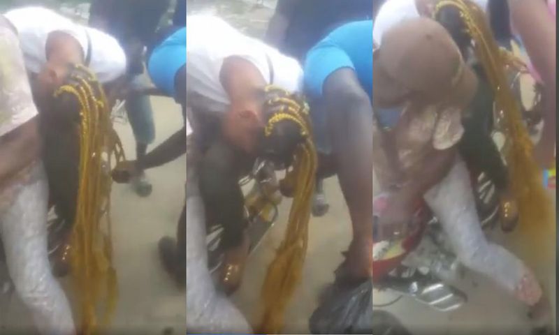 Lady’s long hair gets entangled in the wheels of motorbike