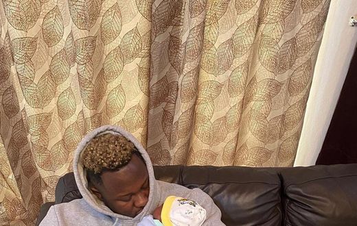 Medikal with his baby girl