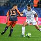 Montpellier's Florent Mollet (R) in action against Strasbourg in a Ligue 1 game in February, just before the 2019/20 season was suspended because of the pandemic