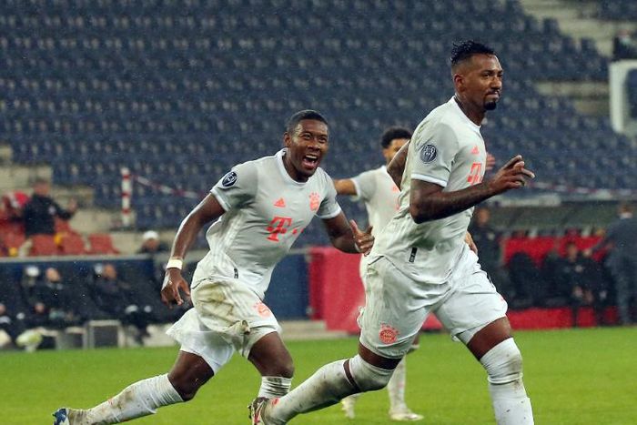 Jerome Boateng (R) says the Bayern Munich squad are behind David Alaba (L)