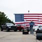 White House hopeful Joe Biden used an all-American backdrop of cars and flags as he stumped in Warren, Michigan on September 9, 2020, although one traditional campaign trail element was missing: voters