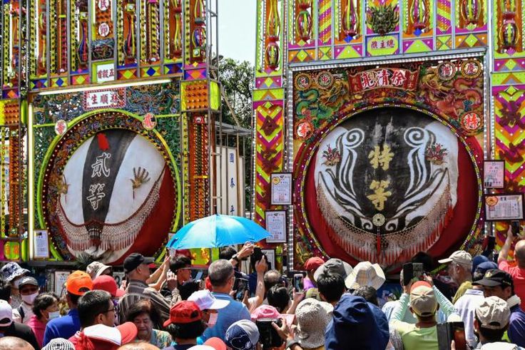 Festival goers looking at exhibits at Yimin temple in Hsinchu, northern Taiwan