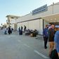 Passengers wait to depart Libya's Mitiga International Airport in Tripoli as flights resume