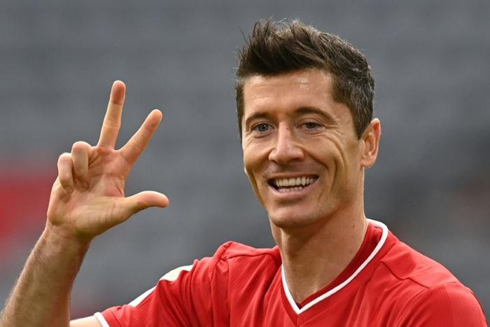 Robert Lewandowski celebrates his hat-trick for Bayern Munich on Saturday