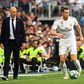 Far apart: Zinedine Zidane watches Gareth Bale