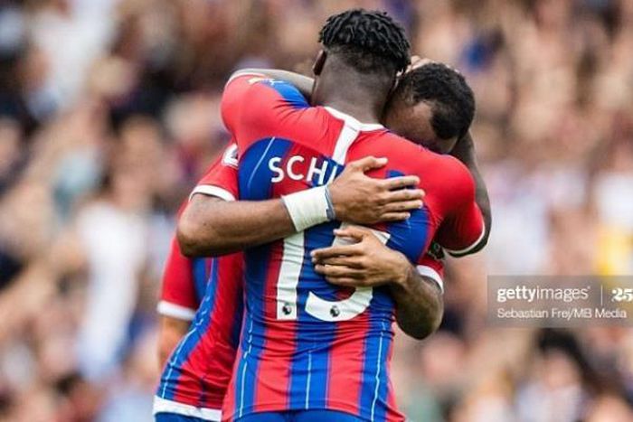 Jeffrey Schlupp embraces Jordan Ayew after the goal