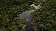 A boat travels on the Jurura river in Carauari, in the heart of the Brazilian Amazon rainforest, in March 2020 -- the entire region is facing many challenges, and now must battle the coronavirus crisis as well