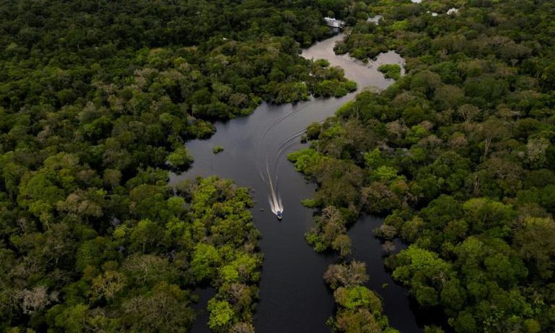 A boat travels on the Jurura river in Carauari, in the heart of the Brazilian Amazon rainforest, in March 2020 -- the entire region is facing many challenges, and now must battle the coronavirus crisis as well