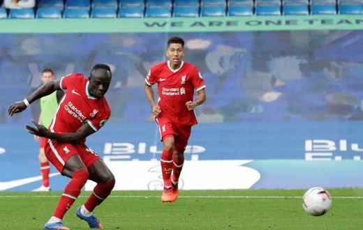 Senegalese Sadio Mane (L) scores his second goal for Liverpool in a 2-0 English Premier League win at Chelsea.