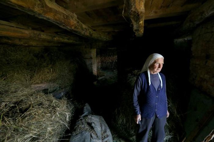 The last intact statue of Albania's communist dictator Enver Hoxha lies hidden under straw in a mountain village