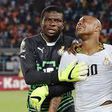 Fatau Dauda on the left and Asamoah Gyan on the right consoling Andre Ayew in the middle at AFCON 2015
