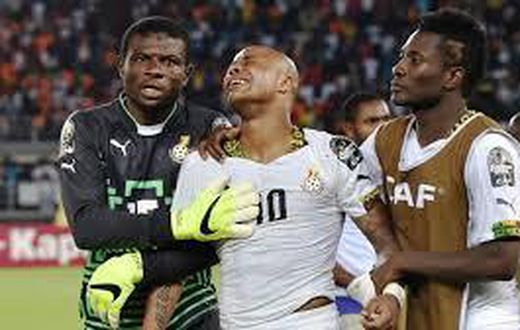 Fatau Dauda on the left and Asamoah Gyan on the right consoling Andre Ayew in the middle at AFCON 2015