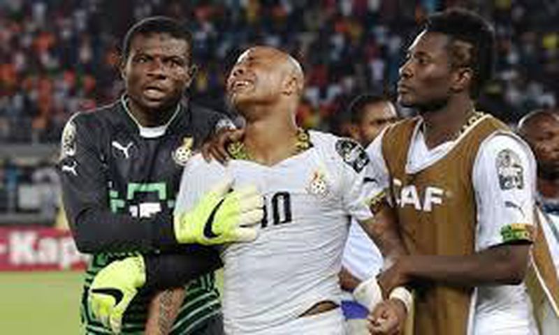 Fatau Dauda on the left and Asamoah Gyan on the right consoling Andre Ayew in the middle at AFCON 2015