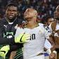 Fatau Dauda on the left and Asamoah Gyan on the right consoling Andre Ayew in the middle at AFCON 2015