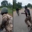 Angry Nigerian soldiers chase, beat police officers makes them return bribes to civilians