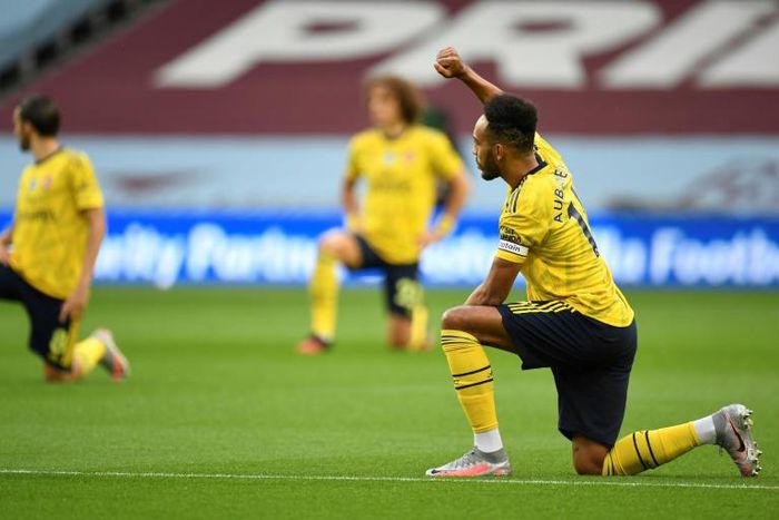 Arsenal striker Pierre-Emerick Aubameyang kneels before a Premier League match