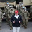US President Donald Trump poses with National Guard troops in Lake Charles, Louisiana, on August 29, 2020 on a trip to survey damage from Hurricane Laura