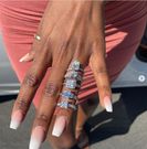 Man proposes marriage to fiancée with 5 different diamond rings, all on the same finger