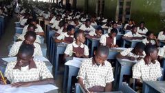 Students writing BECE
