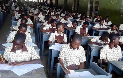 Students writing BECE