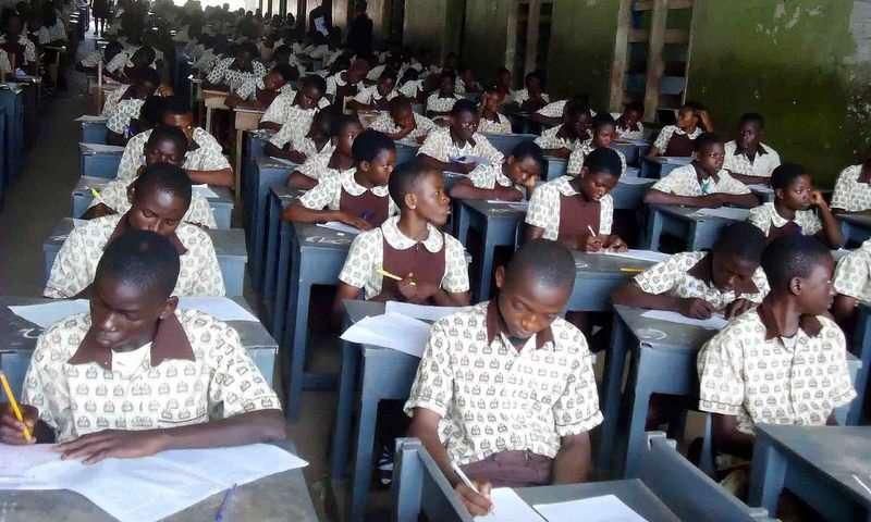 Students writing BECE