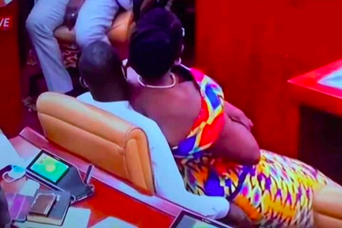 Ursula Owusu-Ekuful sitting on the laps of Akandoh