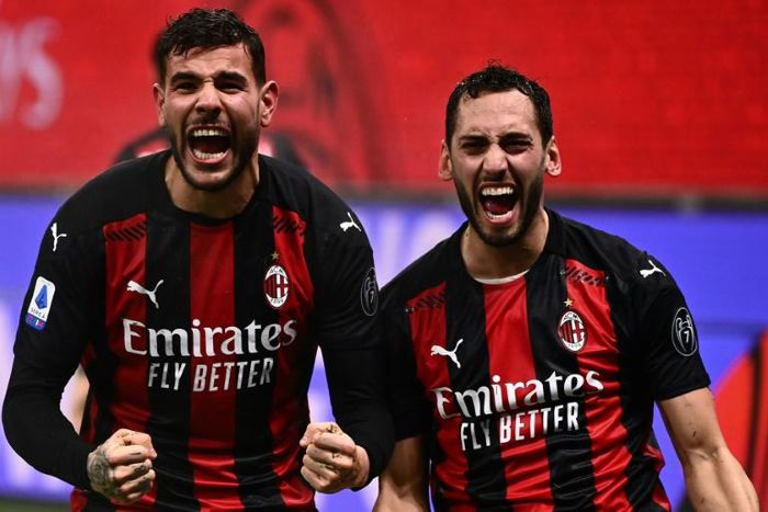 AC Milan's French defender Theo Hernandez (left) and Turkish midfielder Hakan Calhanoglu (right) have both tested positive for Covid-19