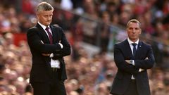 Top-four battle: Manchester United manager Ole Gunnar Solskjaer (left) and Leicester City boss Brendan Rodgers