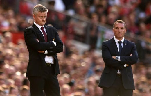 Top-four battle: Manchester United manager Ole Gunnar Solskjaer (left) and Leicester City boss Brendan Rodgers
