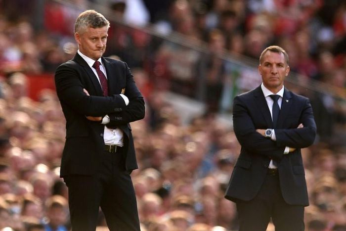 Top-four battle: Manchester United manager Ole Gunnar Solskjaer (left) and Leicester City boss Brendan Rodgers
