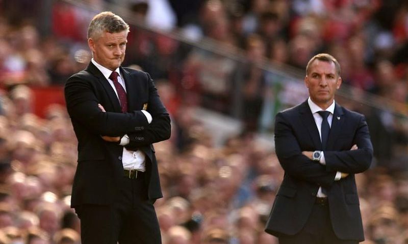 Top-four battle: Manchester United manager Ole Gunnar Solskjaer (left) and Leicester City boss Brendan Rodgers