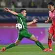Chasing shadows: Kim Young-gwon, one of South Korea's scorers, skips past Annadurdyyev Altymyrat of Turkmenistan