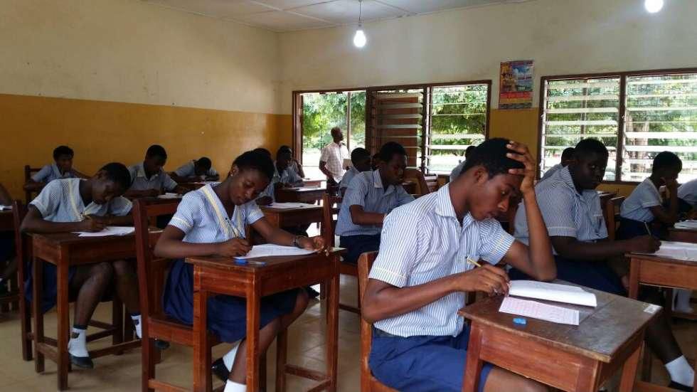 Students writing BECE