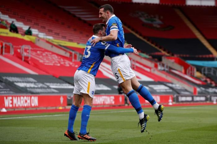 Brighton defender Lewis Dunk (right) celebrates scoring against Southampton