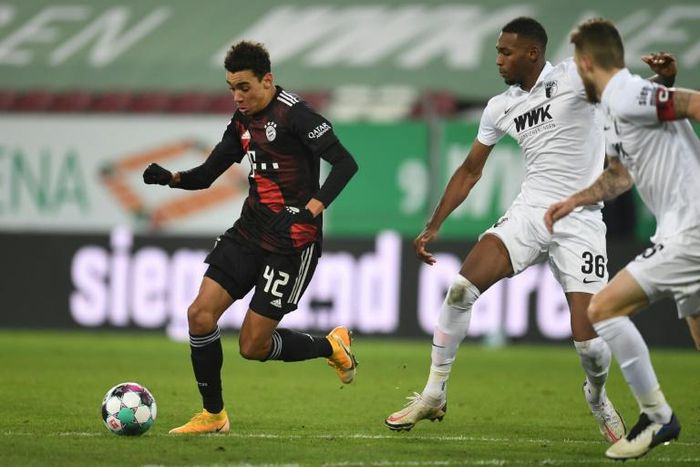 Bayern Munich's 18-year-old midfielder  Jamal Musiala (L) still has to be driven to training by his mum