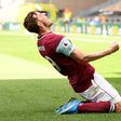 Burnley forward Chris Wood celebrates scoring a hat-trick against Wolves in the Premier League