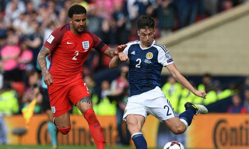 Kieran Tierney (right) has been passed fit for Scotland's clash with England