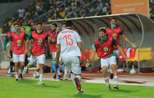 Soufiane Bouftini (C) celebrates scoring the first goal for Morocco in a 4-0 African Nations Championship sem-final victory over hosts Cameroon.