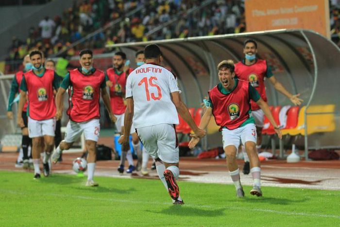 Soufiane Bouftini (C) celebrates scoring the first goal for Morocco in a 4-0 African Nations Championship sem-final victory over hosts Cameroon.