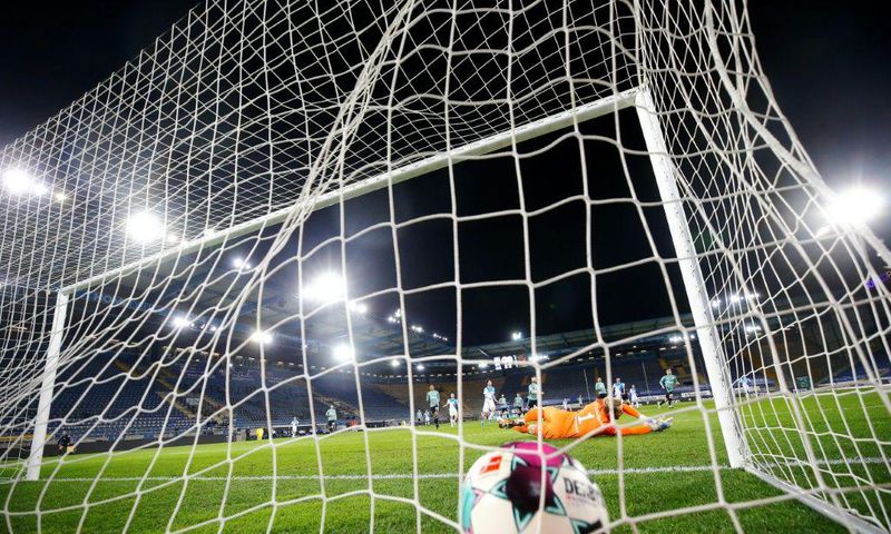 Fabian Klos scores the goal for Bielefeld on Tuesday which confirmed Schalke's relegation from the Bundesliga