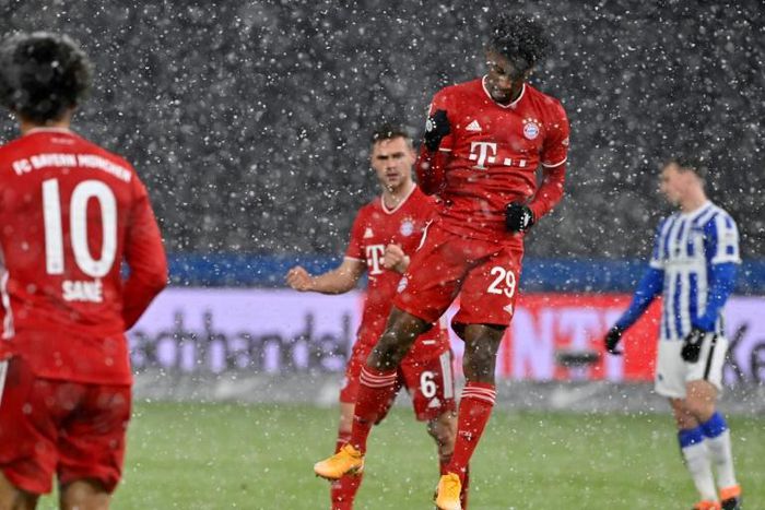 All go in the snow: Bayern Munich's Kingsley Coman celebrates scoring