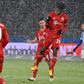 All go in the snow: Bayern Munich's Kingsley Coman celebrates scoring